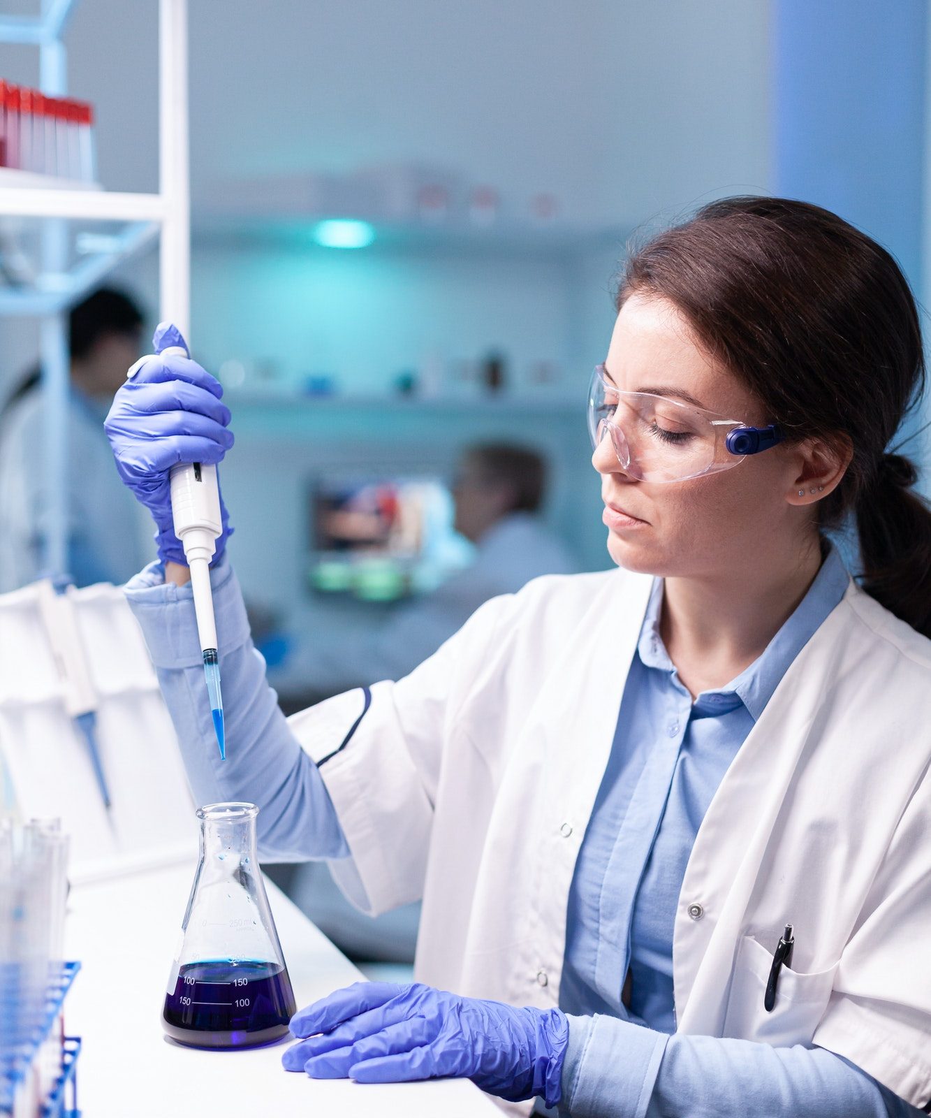 scientist-looking-into-micropipette-for-biology-test